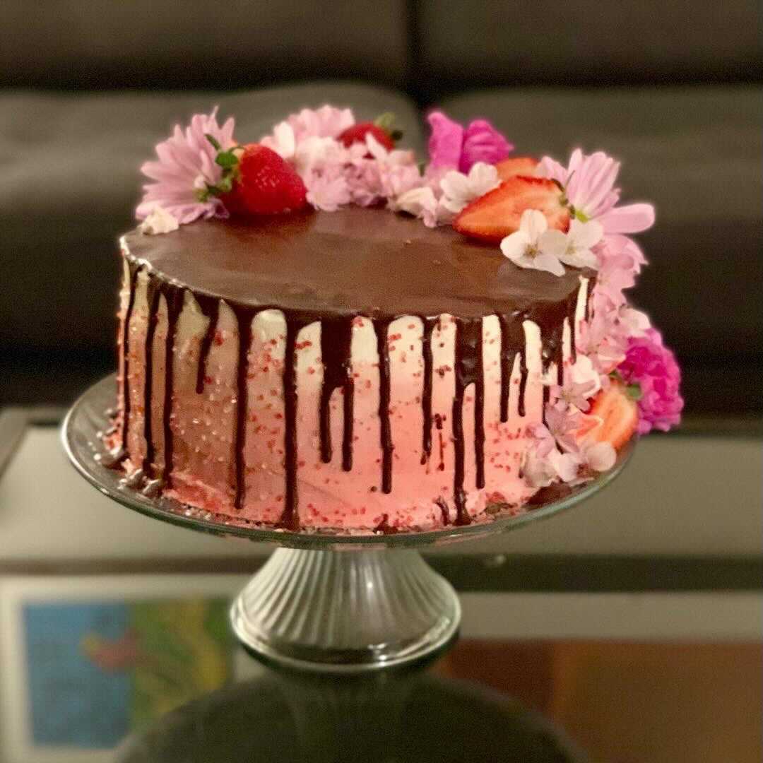LGBTQ Nation editor Bil Browning, an expert baker, made this cake for the husband's birthday. The sprinkles enhance the rose colored frosting.