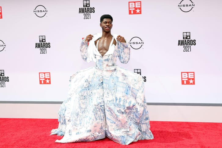 Lil Nas X in a gown on the red carpet.