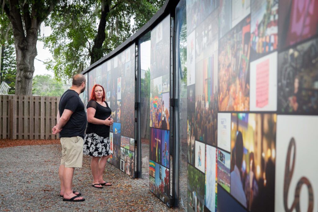 Casey, left and Angie Marie, from Bountiful, Utah, visit the Pulse Interim Memorial. Photo by J.D. Casto for INTO