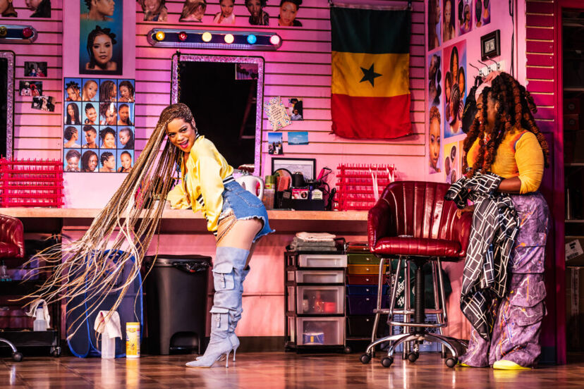 (from left) Kalyne Coleman and Maechi in "Jaja's African Hair Braiding." Photo by Matthew Murphy