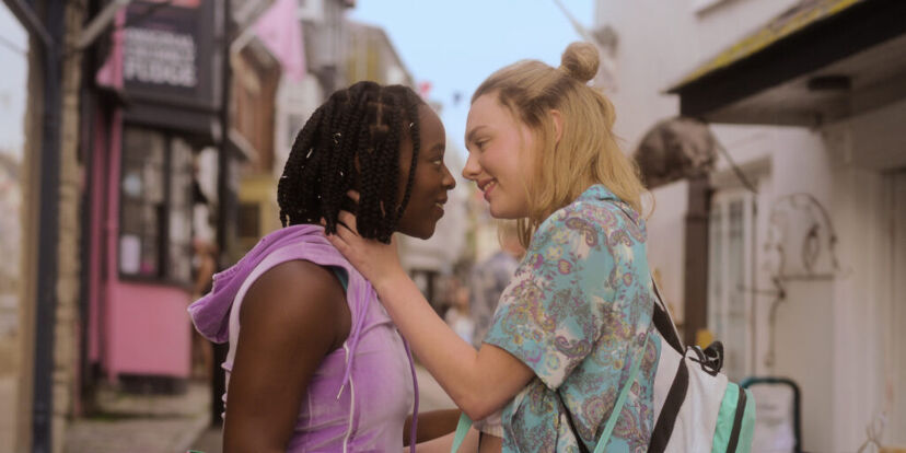 Corinna Brown as Tara Jones and Kizzy Edgell as Darcey Olsson staring lovingly at one another